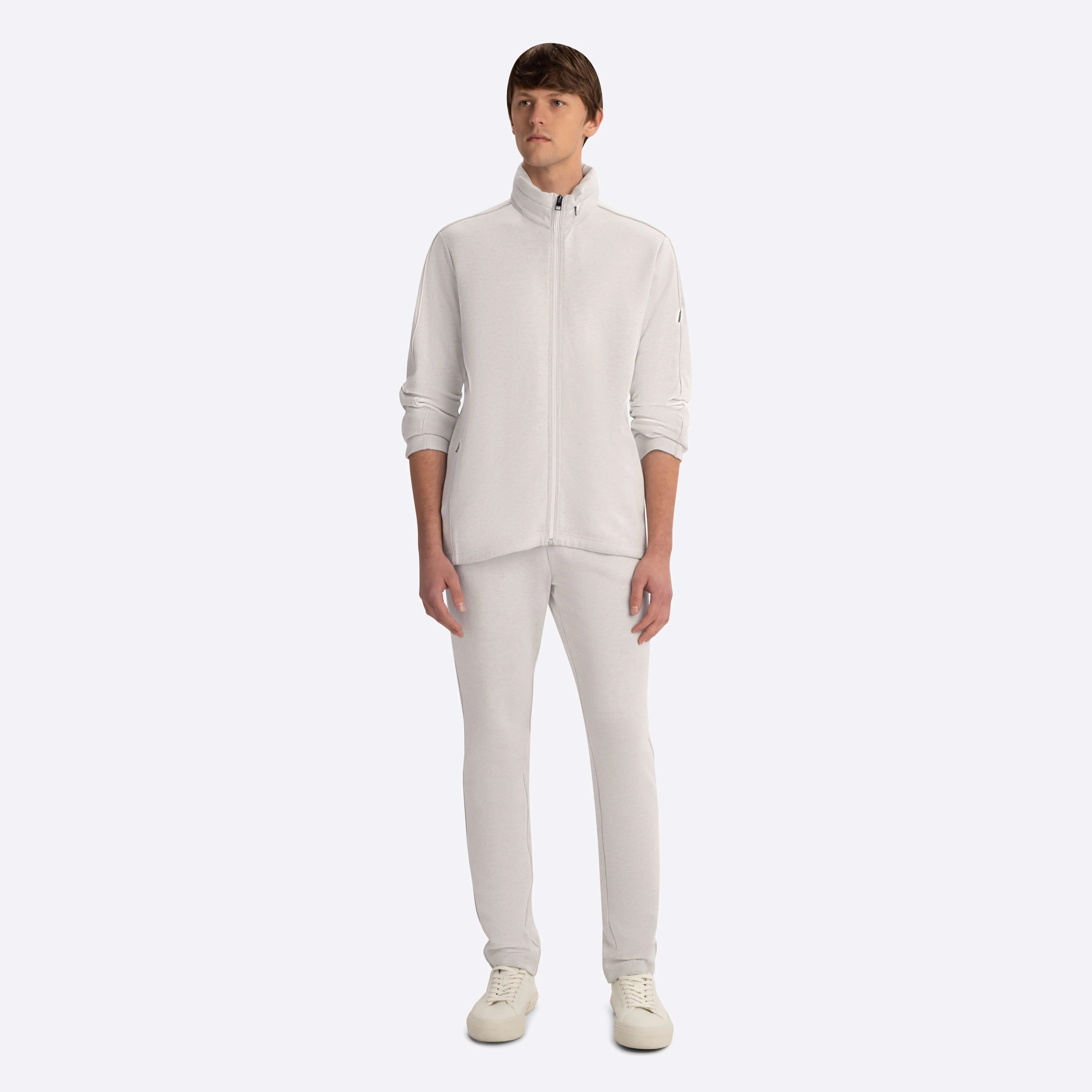Full Zip Mock Neck Sweatshirt with Stow-Away Hood.